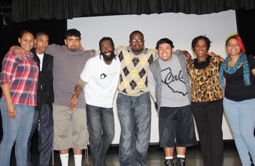 A photo of Ebony Club members standing on a stage