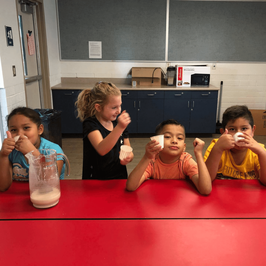 Four students doing an experiment